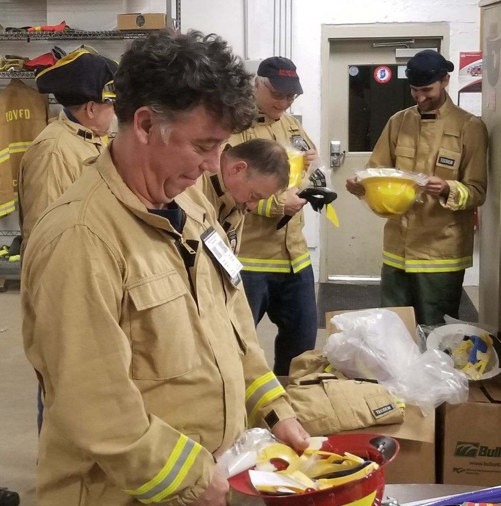 Ogden Dunes Firefighters receiving their new wildland personal protective equipment. Ogden Dunes Firefighters receiving their new wildland personal protective equipment.