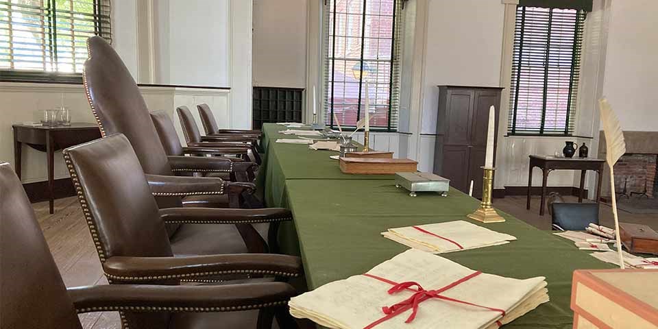 Interior view of courtroom showing the bench for the judges. Interior view of courtroom showing judges bench on raised dais.
