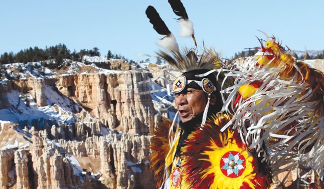 Southern Paiute man in ceremonial dress.