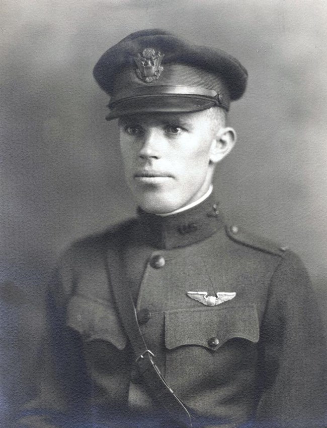 Black and white photo portrait of man in military uniform