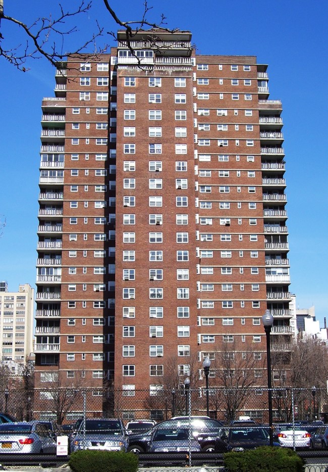 Tall brick apartment complex.