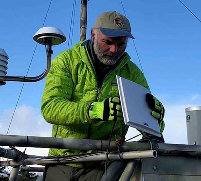 A close up of Peter initializing the weather station.