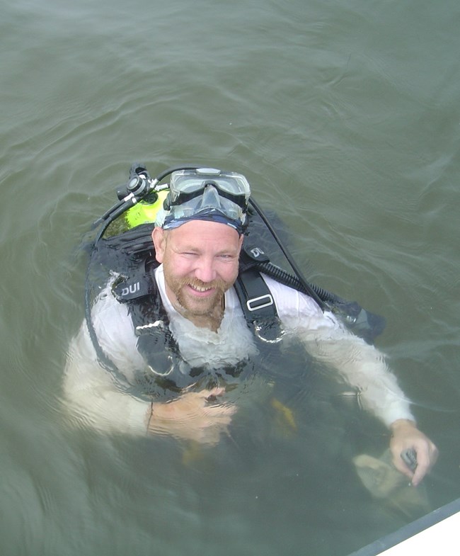 Brad Petersen treads water in scuba gear