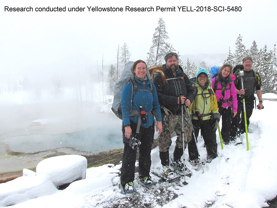Researchers on a snowy day in the Upper Geyser Basin.