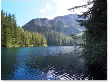 A mountain lake with mountains in the background