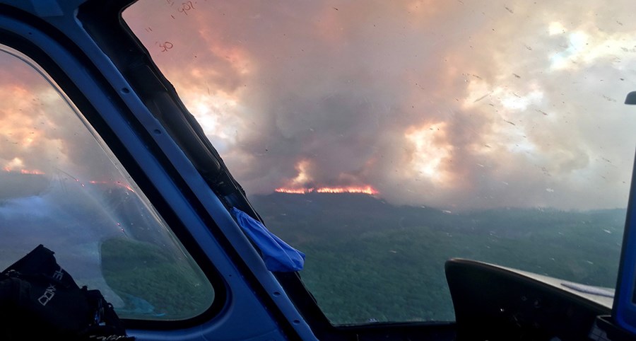 The Andrew Creek Fire can be seen in the distance at Yukon-Charley Rivers National Preserve.