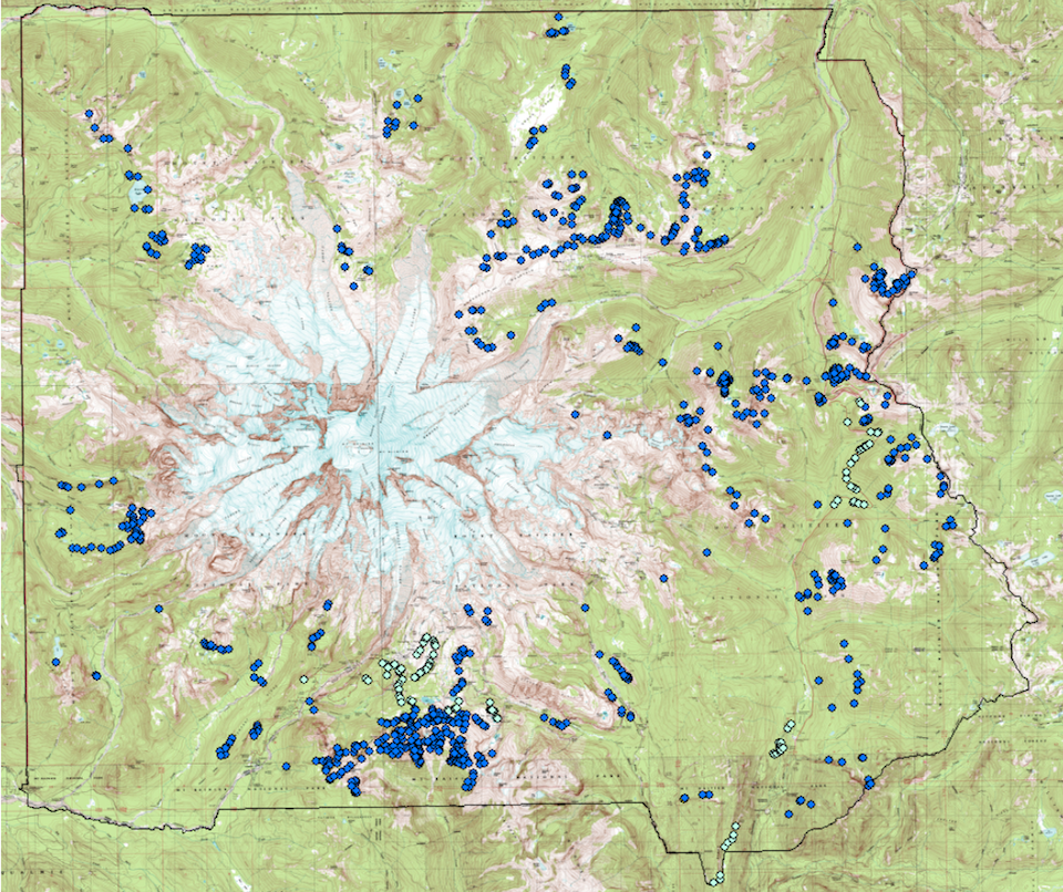 A map of Mount Rainier National Park with light and dark blue dots marking locations on the slopes around the mountain.