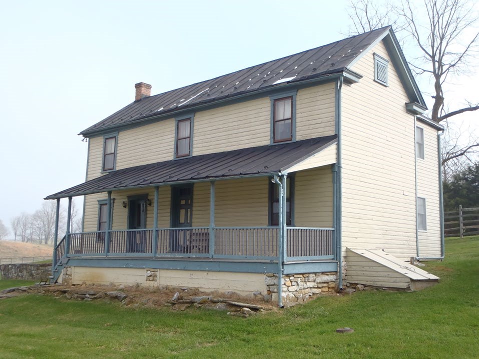 Two-story home with a covered front porch.