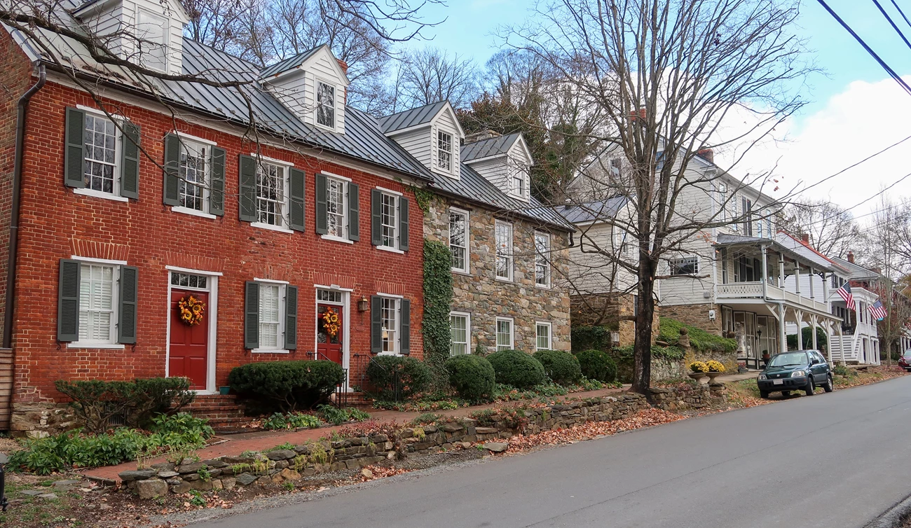 Several historic houses on Main Street in the Waterford Historic District Color photo of several historic houses, on the left side of the image, lining the northeast side of Main Street