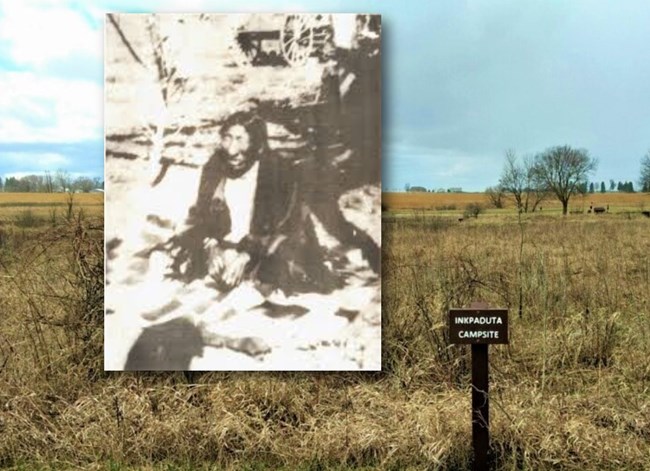 Photo of Inkpaduta next to prairie and sign