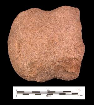 Photo of brown Broken Stone Axe found in one of the Rock Creek Quarries.