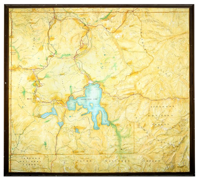 Figure 3. This replica Yellowstone National Park topographic relief model with visitor help features is located in the Mammoth Community Center. The relief of this model is Howell’s but only shows park boundaries, roads, place names, and visitor guides.