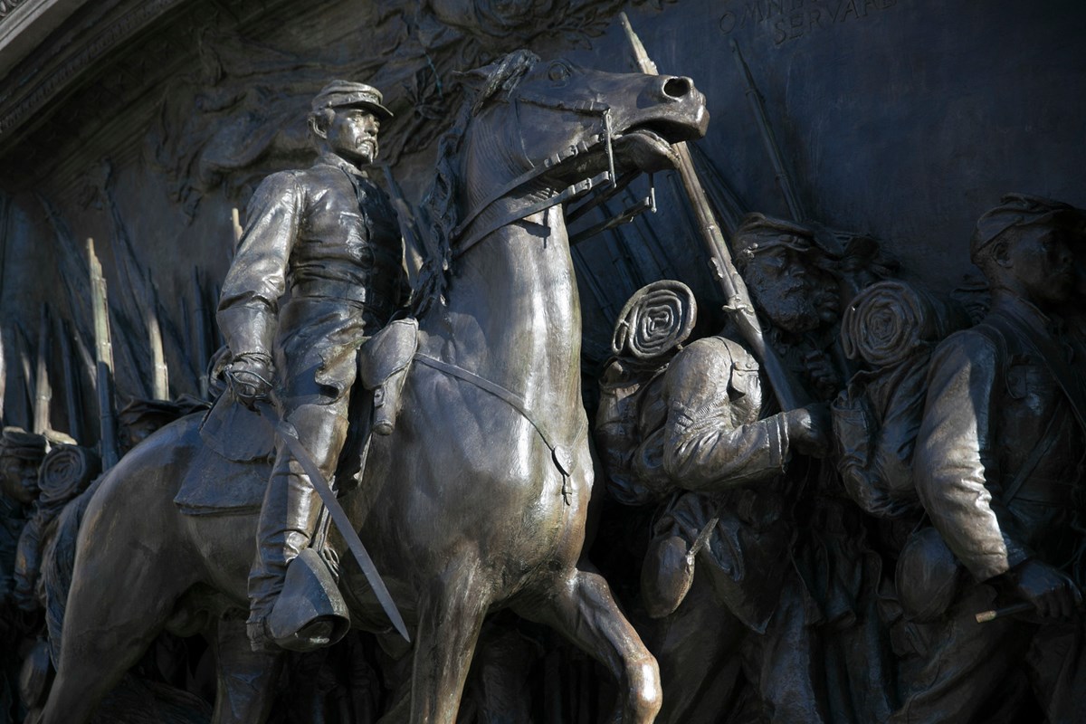 close up of memorial, looking up at Shaw on horseback and the soldiers marching with him