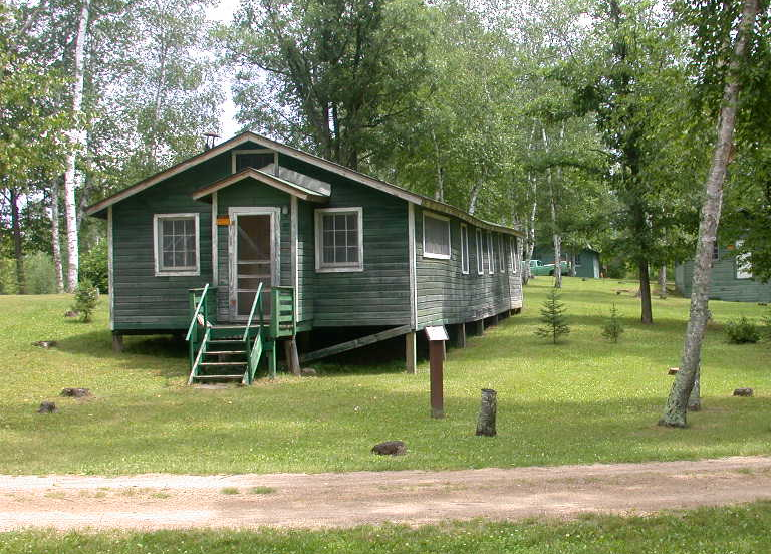 Rabideau CCC Camp Green building among trees.