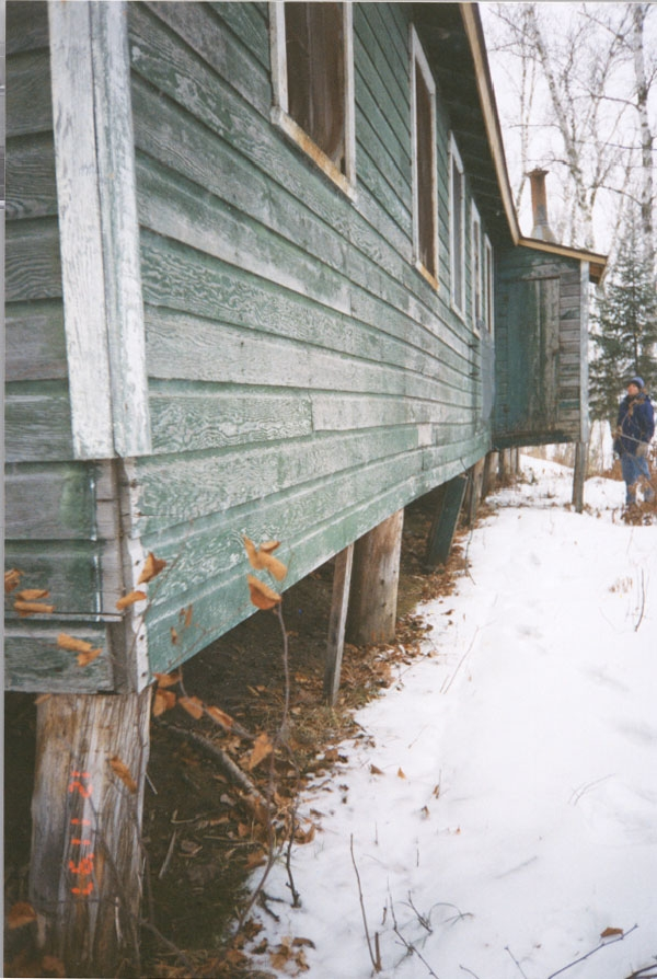 Ribideau CCC Green building on stilts in the snow.