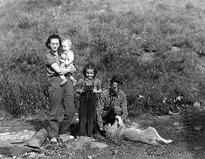 This 1940 photograph shows Adolph Murie, his wife Louise, son Jan, and daughter Gail in Mt. McKinley National Park. This 1940 photograph shows Adolph Murie, his wife Louise, son Jan, and daughter Gail in Mt. McKinley National Park.