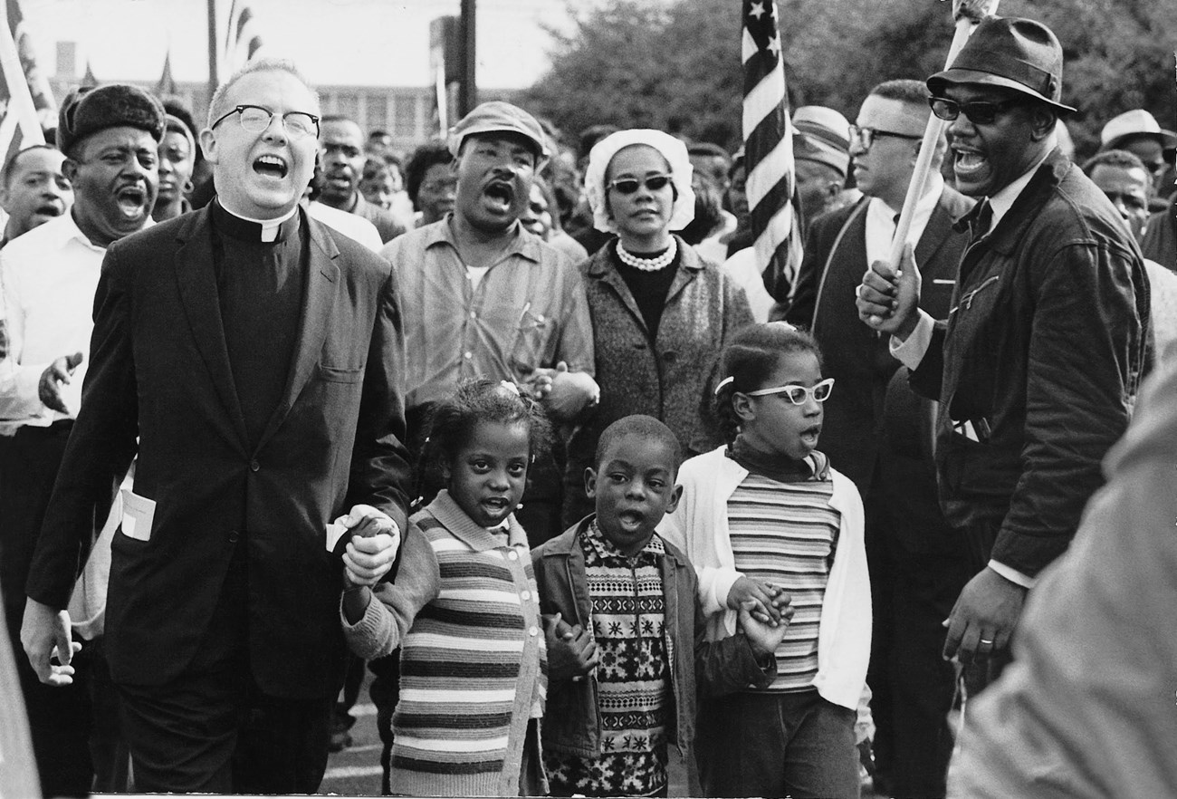 A group of people leading the Selma to Montgomery March in 1965