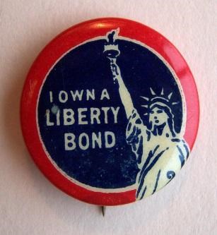 Small red and blue pin with image of statue of liberty