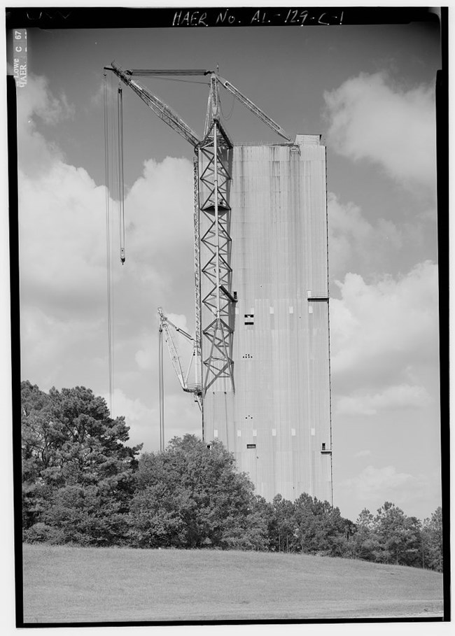 Saturn V Dynamic Test Stand; tall concrete building with two cranes