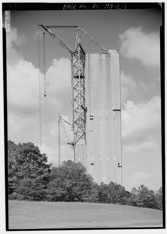 Saturn V_Dynamic Testing Saturn V Dynamic Test Stand; tall concrete building with two cranes