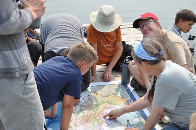Students look at a relief map together.