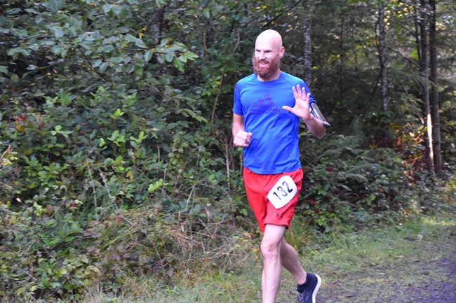 Runner waving to the camera