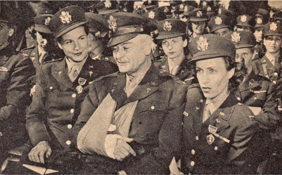 Colonel James W. Duckworth with two of the nurses who served in his command on Bataan, Lieutenants Hogan and Palmer