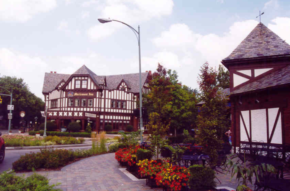 Village of Mariemont Brown and white buildings on a street.