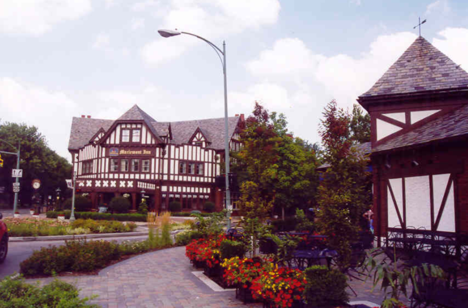 Brown and white buildings on a street.