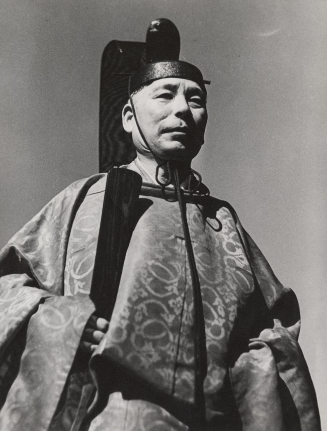 Shinto Priest Reverend Sakuichi Sutow A black and white portrait shows Shinto priest Reverend Sakuichi Sutow in ceremonial dress.