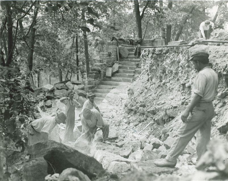 Stan Hywet Hall in the 1920s B&W photo of construction workers building a wall.