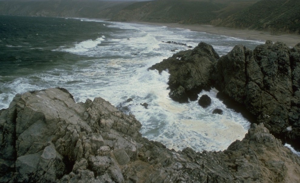 storm waves breaking on rocky coast