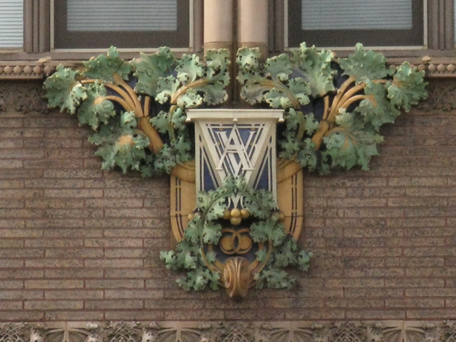 Sullivan architecture intitials Green tree like design with the initials AV in white.