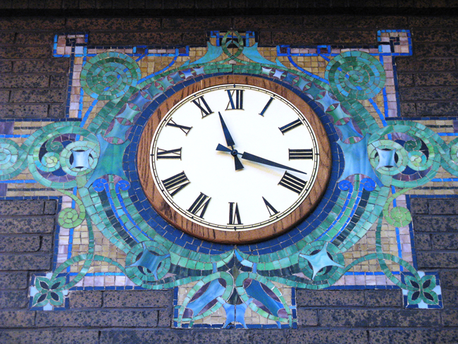 Sullivan style mosaic Clock with a colorful mosaic around it.