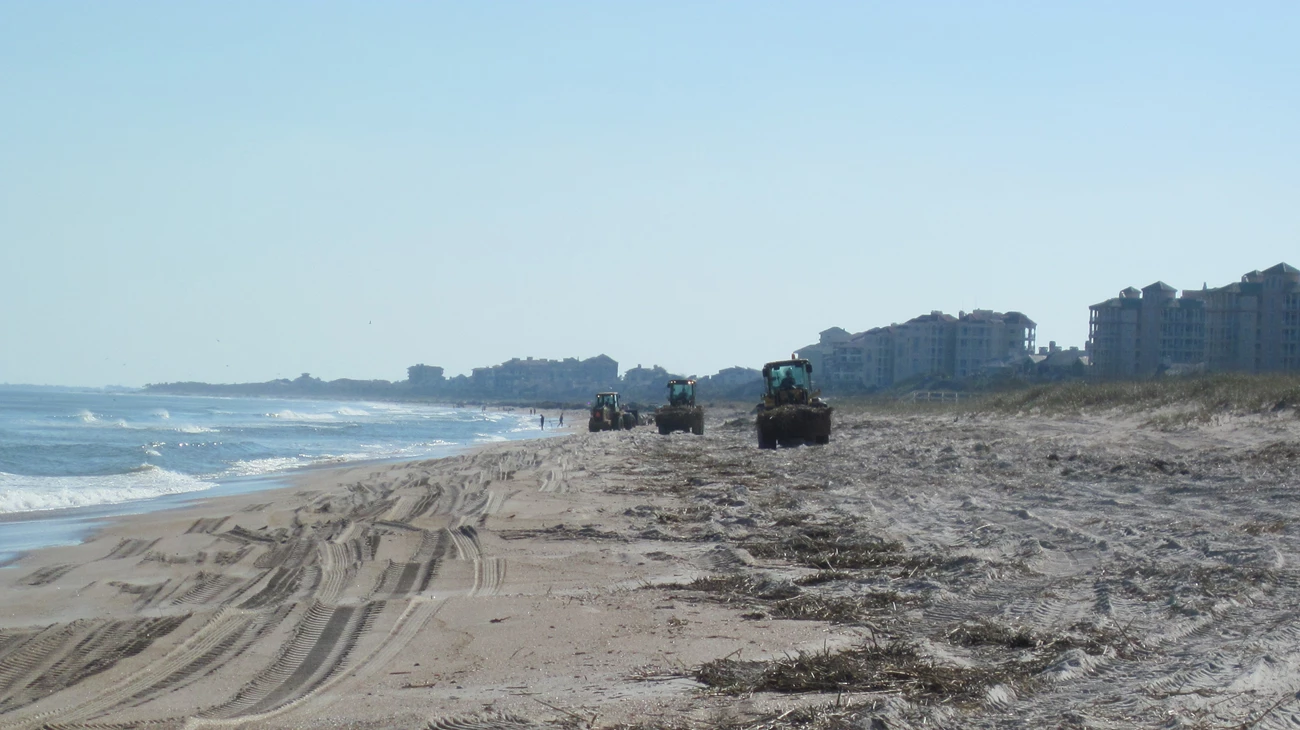 American Beach near Timucuan Ecological and Historic Preserve. Heavy equipment rides along the beach