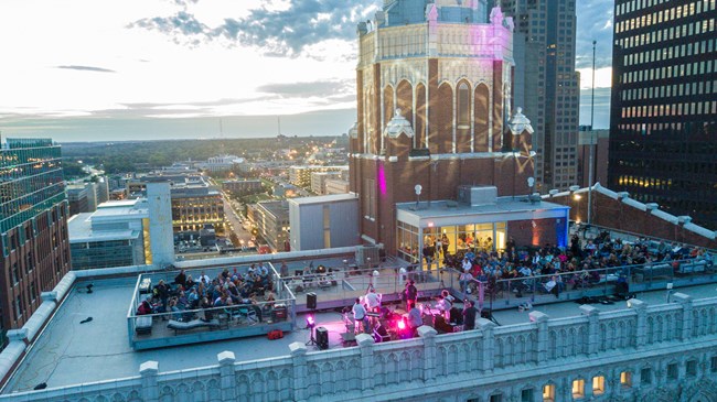 Gathering on the rooftop of the Equitable Building at dusk.