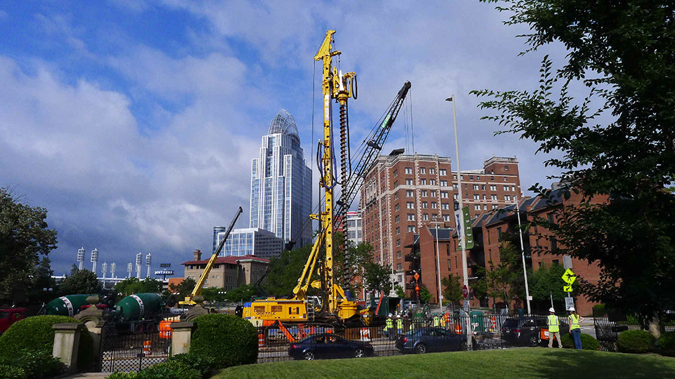 The Lytle Tunnel Rehabilitation Project. Tall buildings and construction machinery.