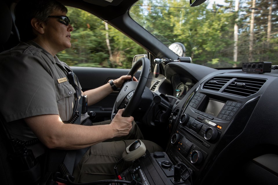 Ranger inside her patrol vehicle Ranger inside her patrol vehicle