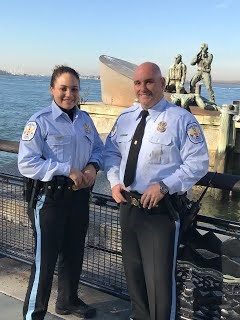 Female and Male United States Park Police officers pose for photo.