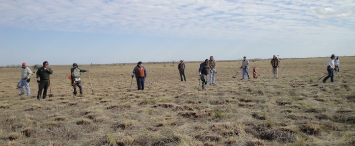 VIPs helping survey Palo Alto Battlefield National Historical Park with metal detectors