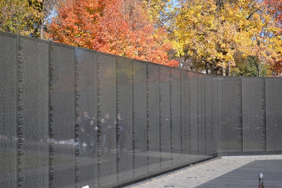 Black-colored memorial wall listing more than 50,000 names of soldiers