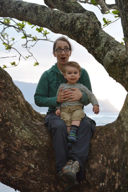 Katie Vinzant and her son, excited to be sitting in a cool tree Kauai, HI.