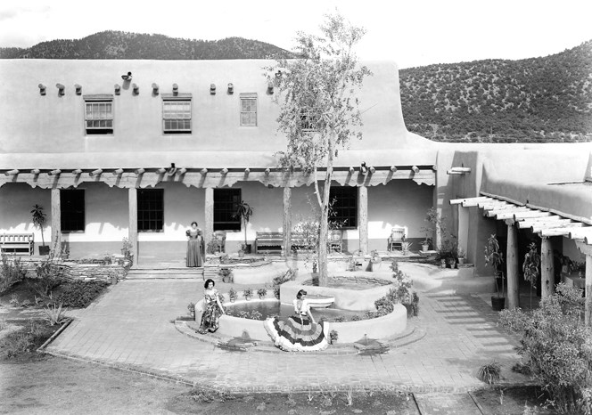 Historic image of women in building courtyard