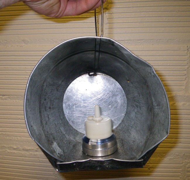 flameless candle in metal reflector bucket