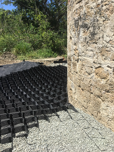 Gravel pad next to the masonry tower