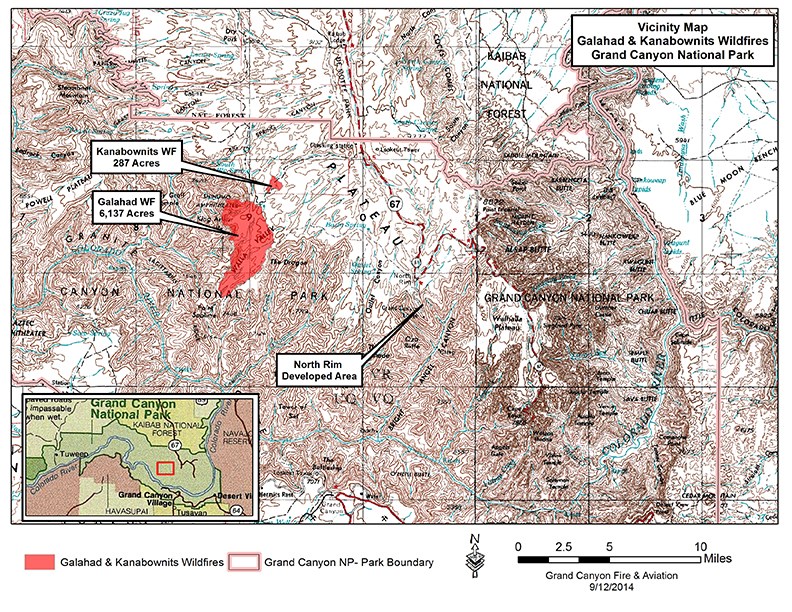 Map showing the Galahad and Kanabownits fires’ proximity to one another White topographic map with red shaded areas to indicate fire footprints.