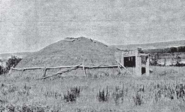 side view of earthlodge with door facing right