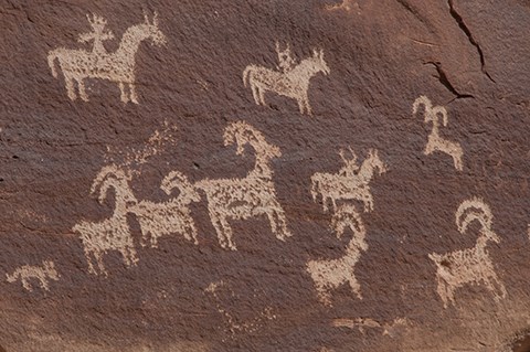 pecked depictions of bighorn sheep and riders on horseback