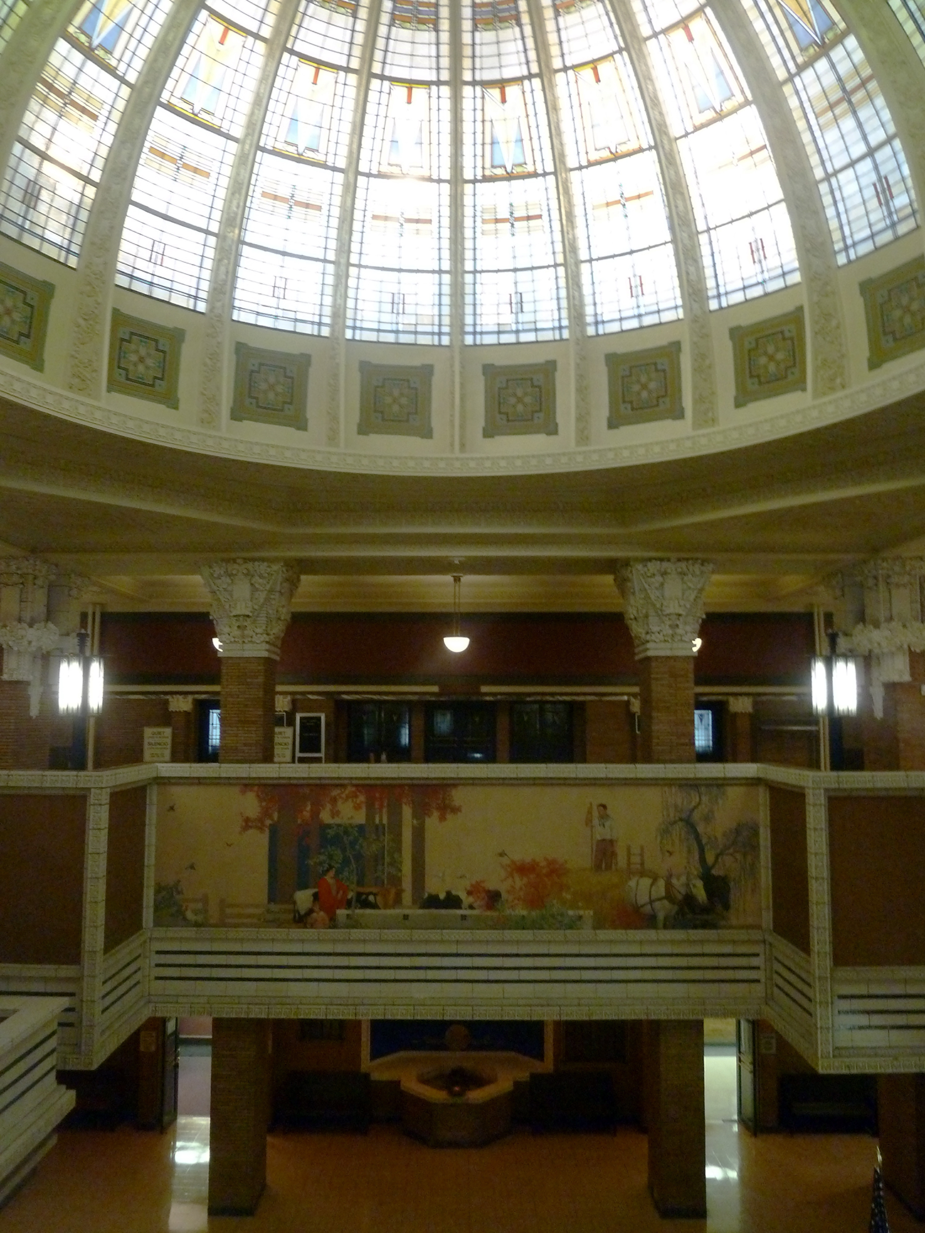 Woodbury County Courthouse rotunda Glass rotunda, painted mural, and pillars.