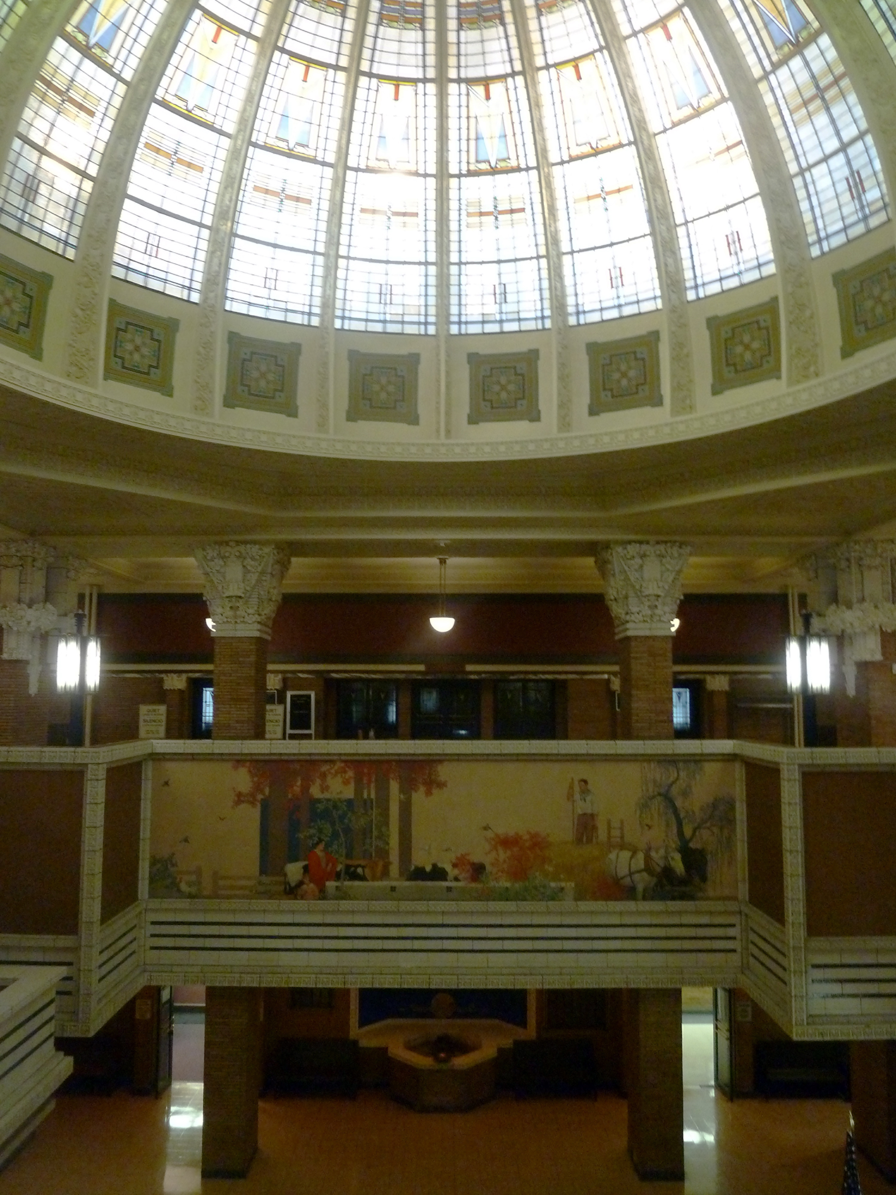 Glass rotunda, painted mural, and pillars.